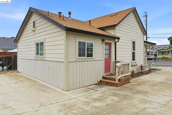 View of front of property with a shingled roof