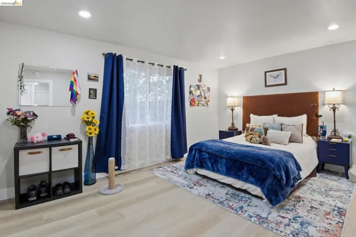 Bedroom featuring wood finished floors and recessed lighting