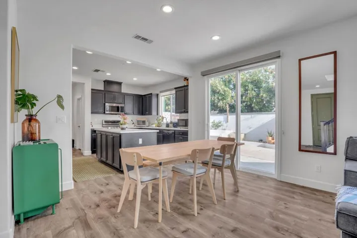 Dining room featuring light wood-style floors and recessed lighting