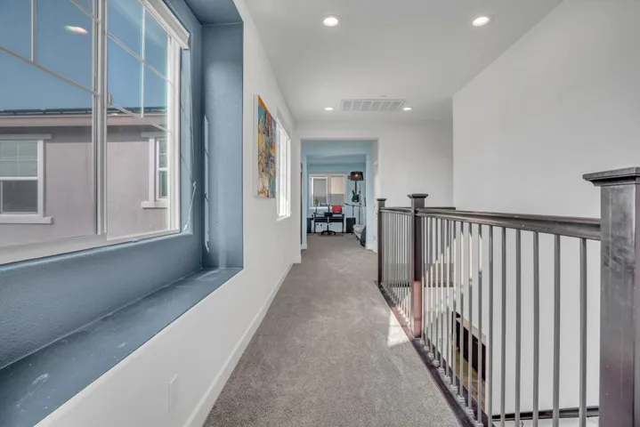 Corridor featuring carpet floors and recessed lighting