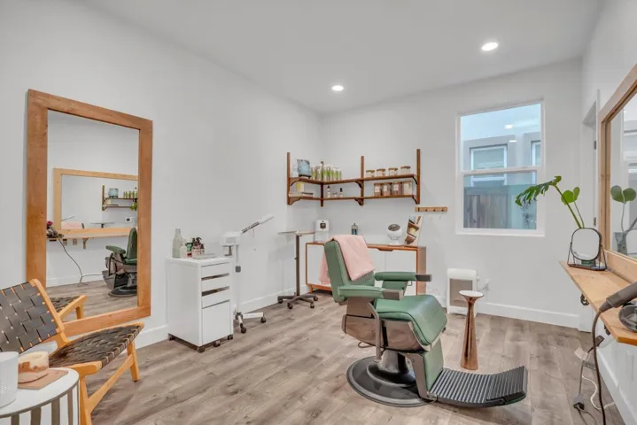 Living area featuring wood finished floors and recessed lighting