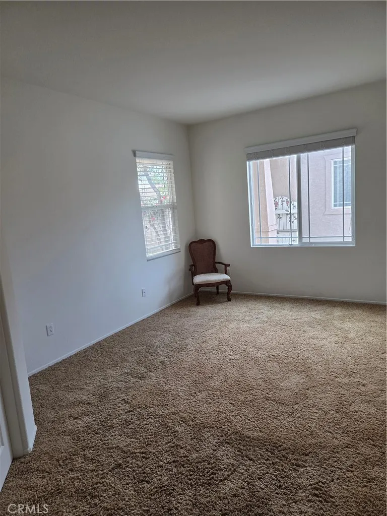 Downstairs Bedroom looks out onto Entryway.