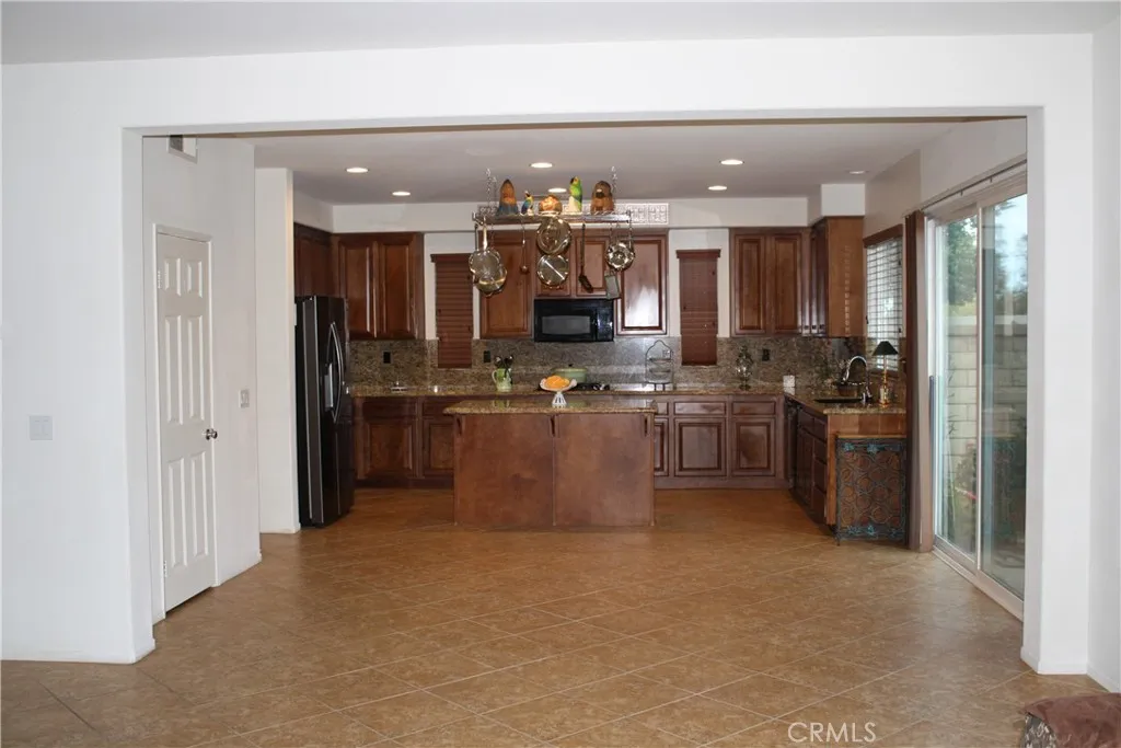 Enough room for dining with a Large Pantry and door leading into the garage.