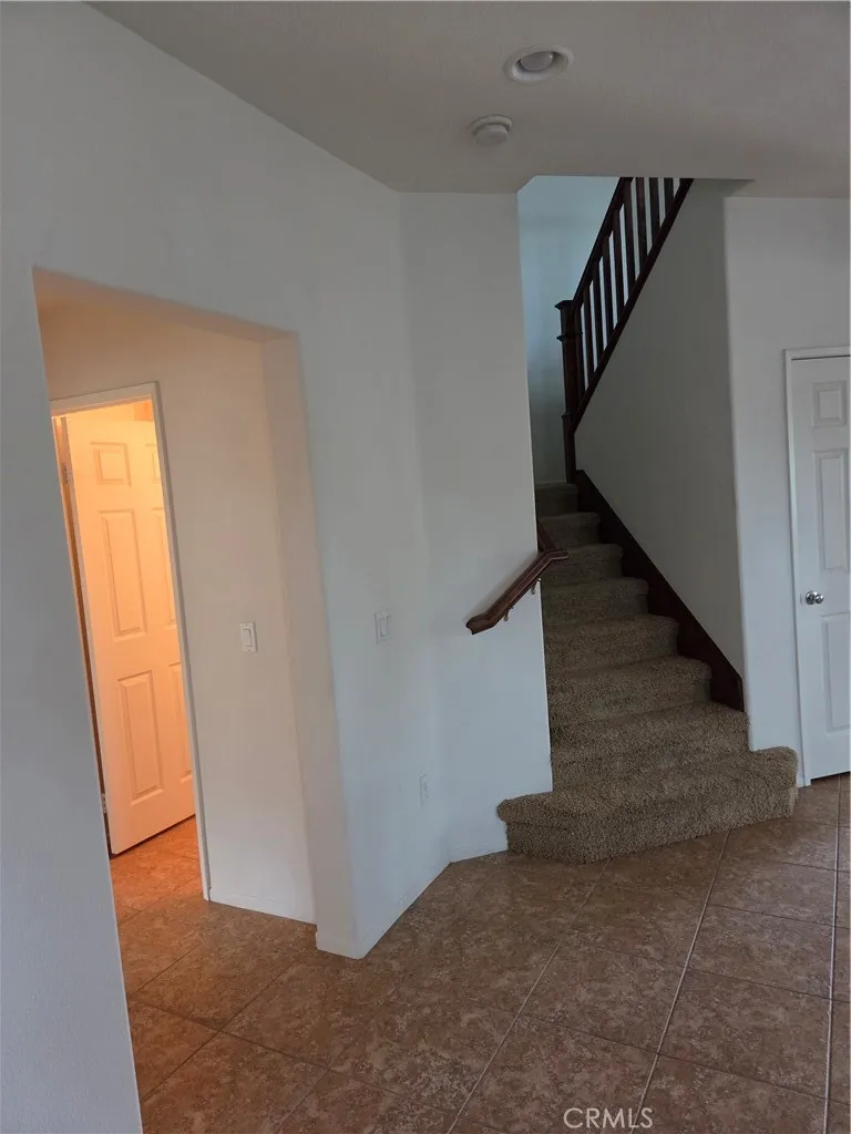 Entryway leading to Downstairs Bedroom and Downstairs Bathroom.
