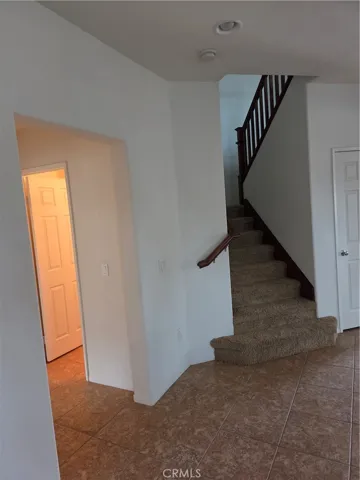 Entryway leading to Downstairs Bedroom and Downstairs Bathroom.