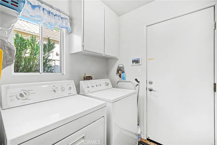Dedicated Indoor Laundry Room With Storage