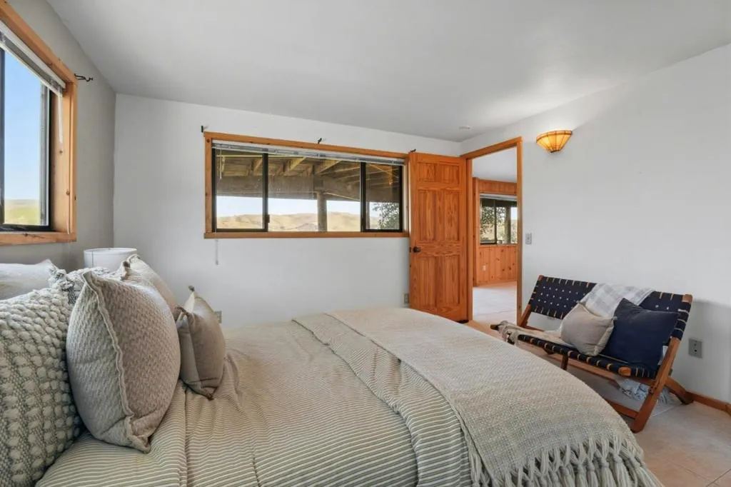 Main house lower level bedroom suite; see the views from bed!