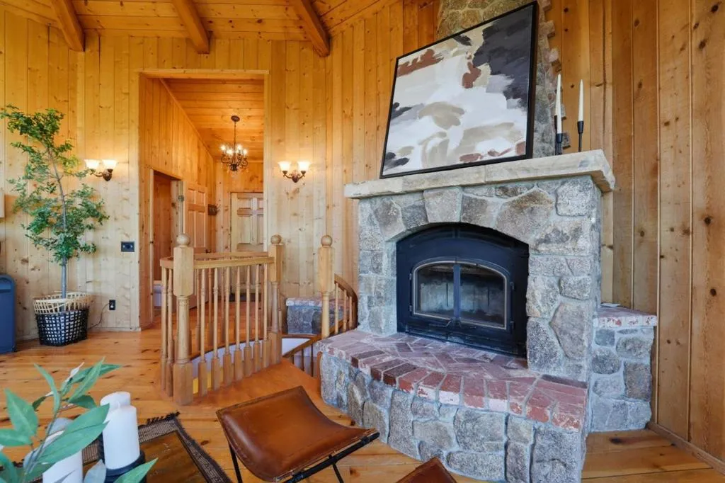 Main house living room; Stone set wood burning fireplace, creating a cozy Carmel Valley Ranch vibe