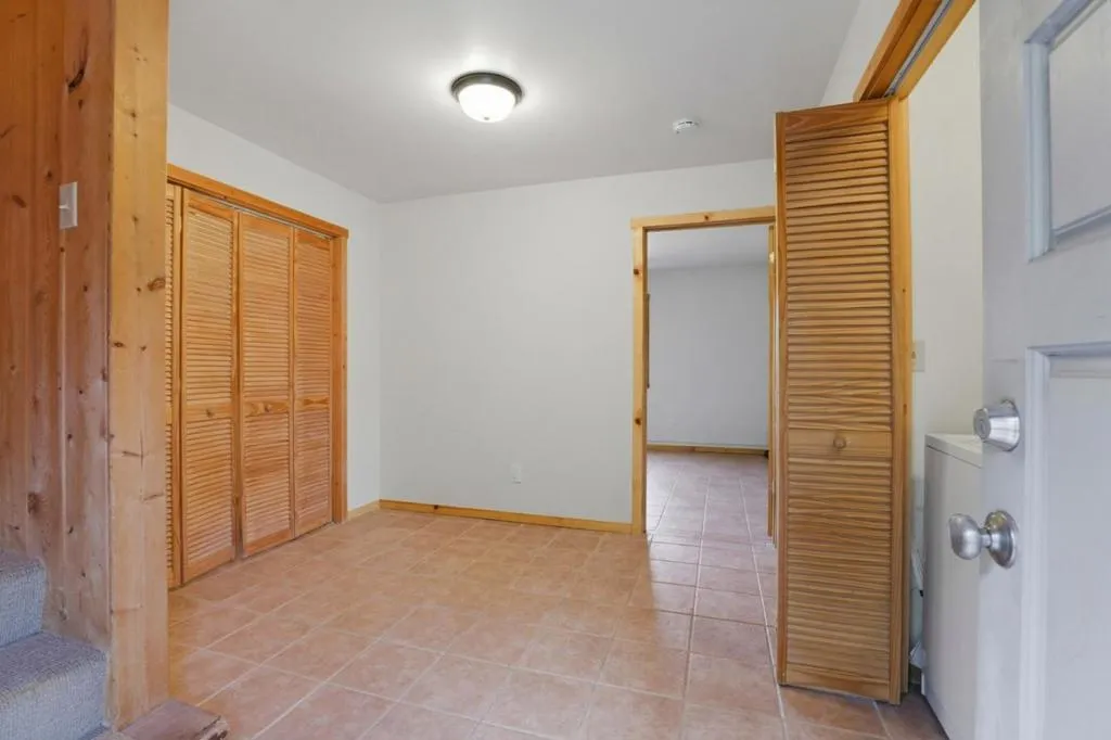 ADU entry / sitting area (storage closet to left and laundry closet to right)