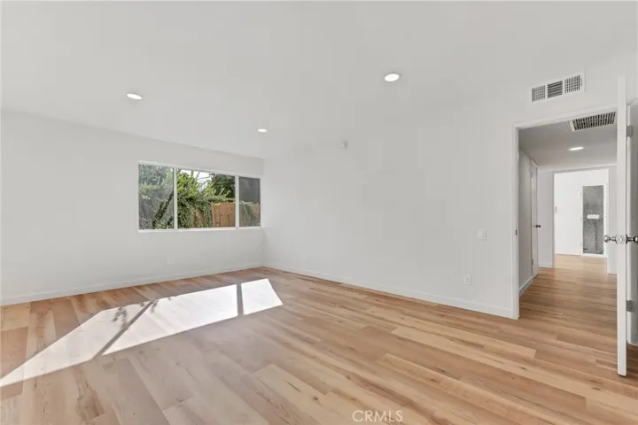 Primary bedroom overlooking private patio