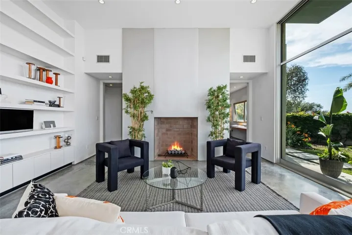 The fireplace is a central focal point in living room.