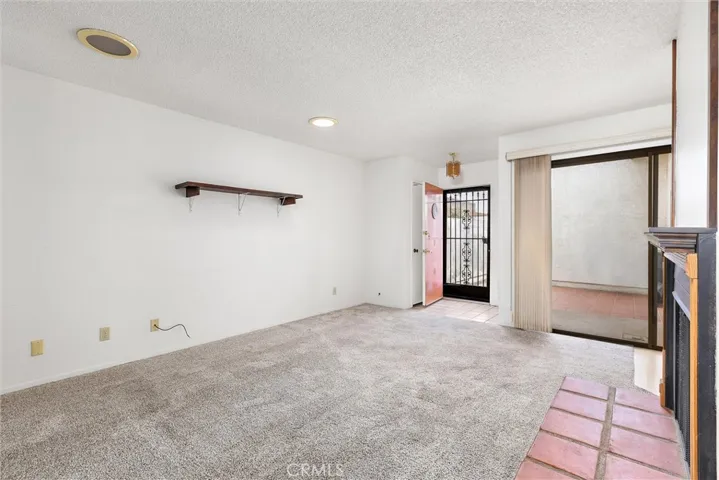 Living room with sliding door to courtyard/patio