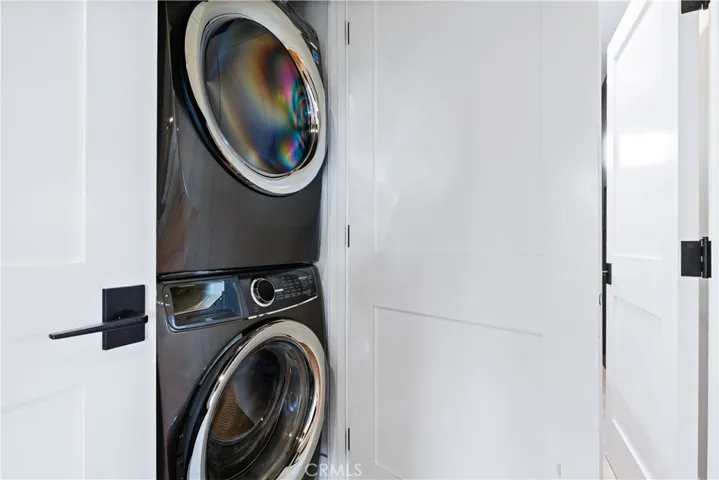 laundry in closet downstairs by bedrooms