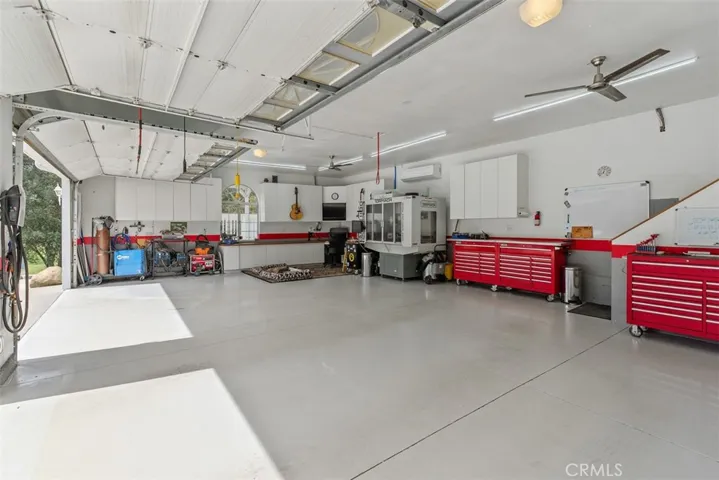 Garage has pull down compressed air, electric and water
