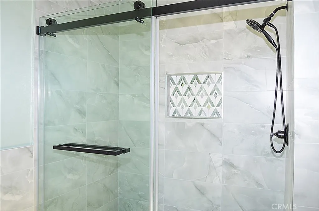 Unit 1 - Main Suite Bath with Dual Sinks, Lighted Mirrors, Walk-in Shower with Custom Tile, and Private Water Closet