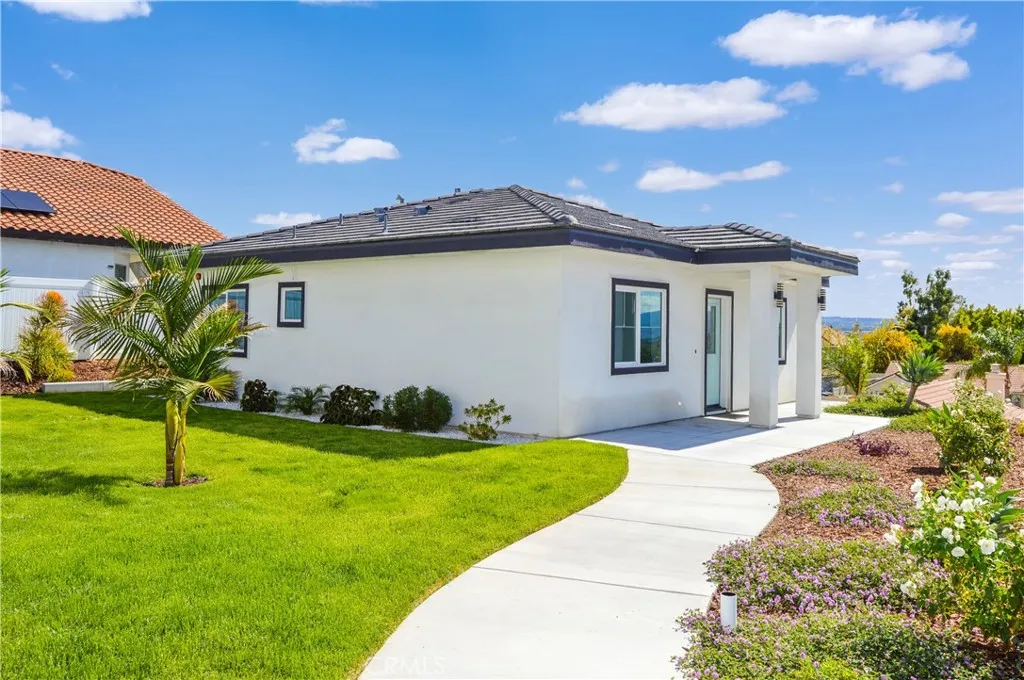 Walkway along units with lawn in between
