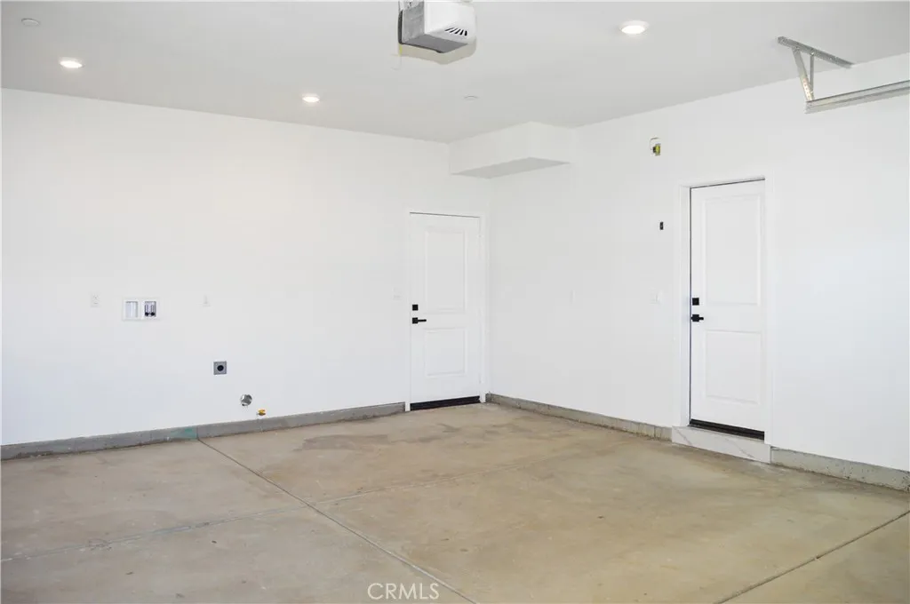 Unit 1 - Garage with Laundry and Door to Backyard