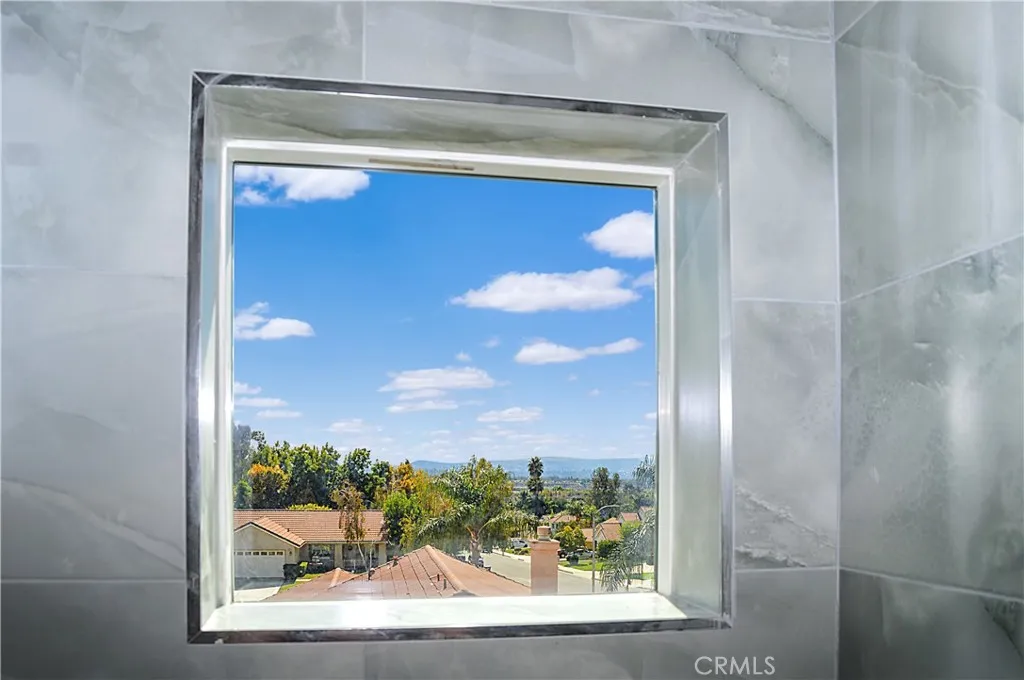 Unit 2 - Main Suite Bath with glass-enclosed shower, lighted mirror and even a view from the shower