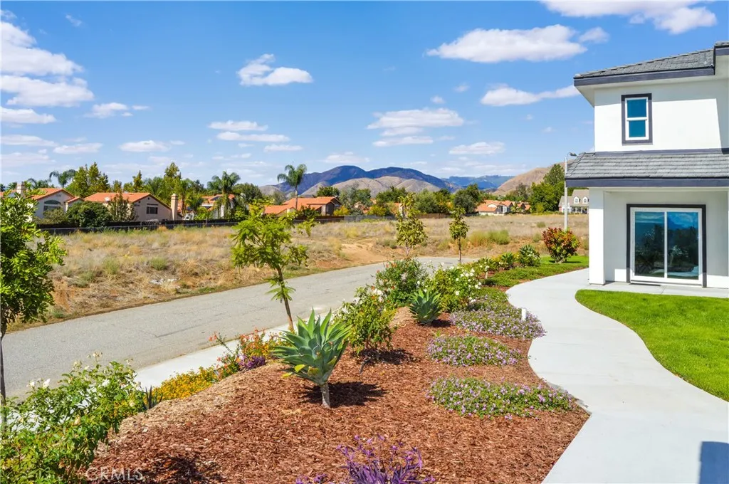Walkway along units with landscaping and views