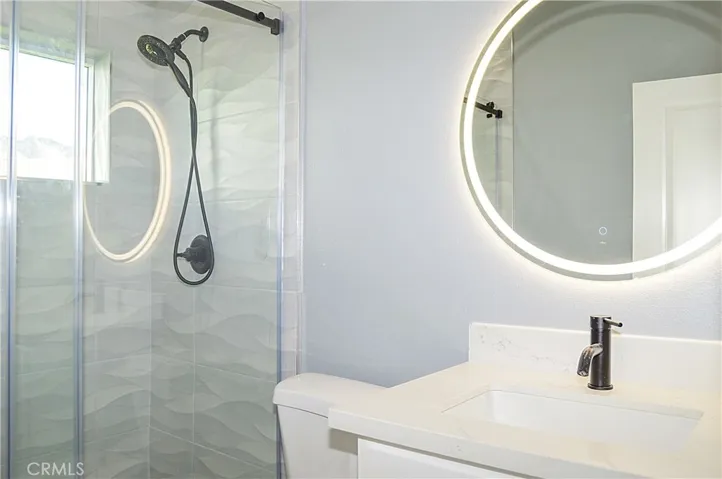 Unit 2 - 2nd Bath with glass-enclosed shower and lighted mirror