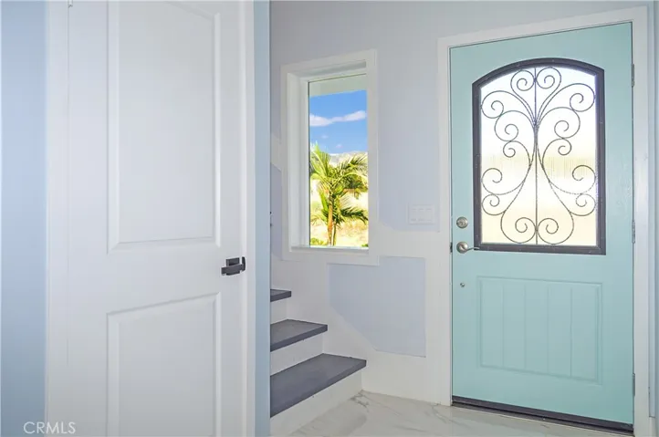 Unit 1 - Closet Under Stairs by Entry