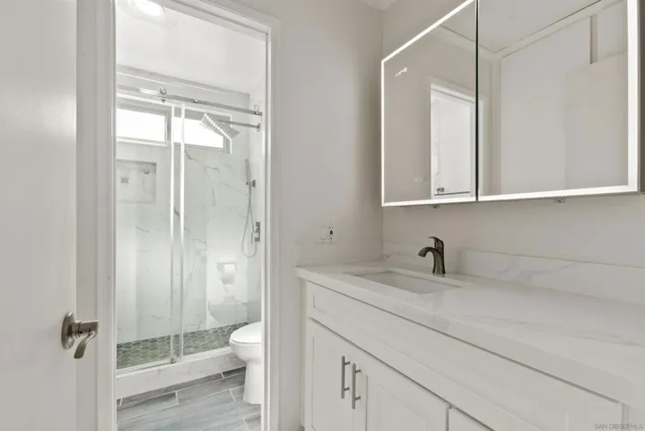 Primary bedroom bathroom with walk in shower