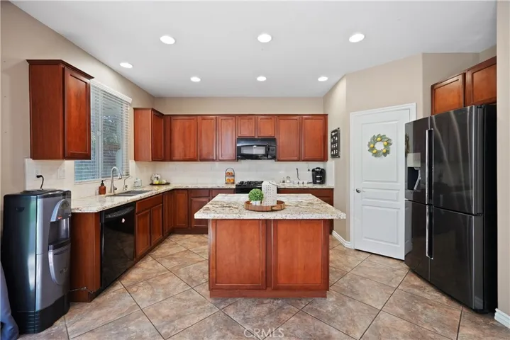 Kitchen highlighted by a spacious island with bar-style seating.