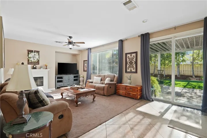 Family room framed by expansive sliding glass doors to the backyard.