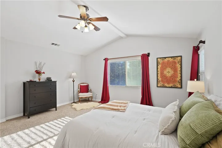 Airy and comfortable primary bedroom layout.