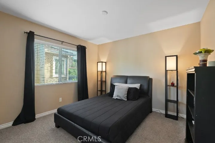 Quiet, light-filled bedroom five.
