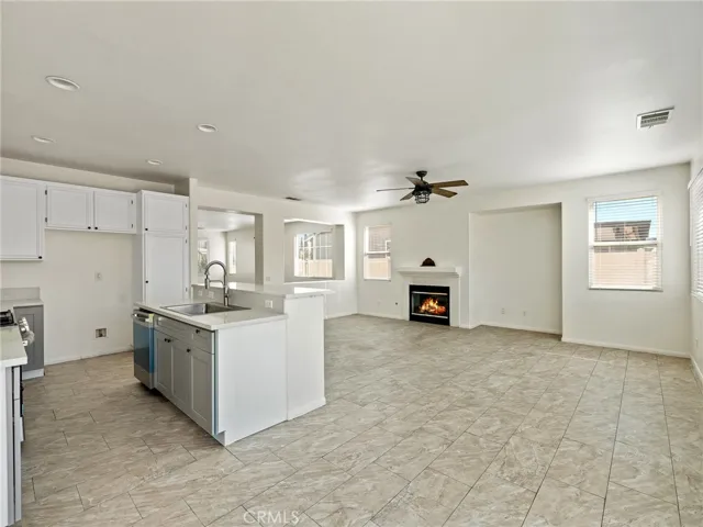 Here is a great picture of how the kitchen and breakfast bar is right off the family room which is wonderful when enjoying your favorite Television programs or just hanging out with friends and family!