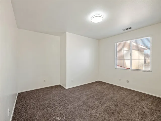 A versatile Den offers the perfect opportunity for a potential fourth bedroom, home office, or playroom. Recently refreshed with new carpeting, fresh paint, and updated lighting, this space is move-in ready and full of possibilities.