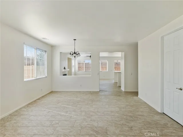 Look how large the Living room is which also has all tiled flooring and space for a dining area in close proximity to the kitchen and family room.