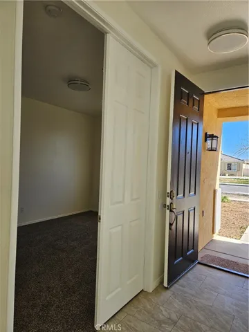 The Den has double doors and new carpeting