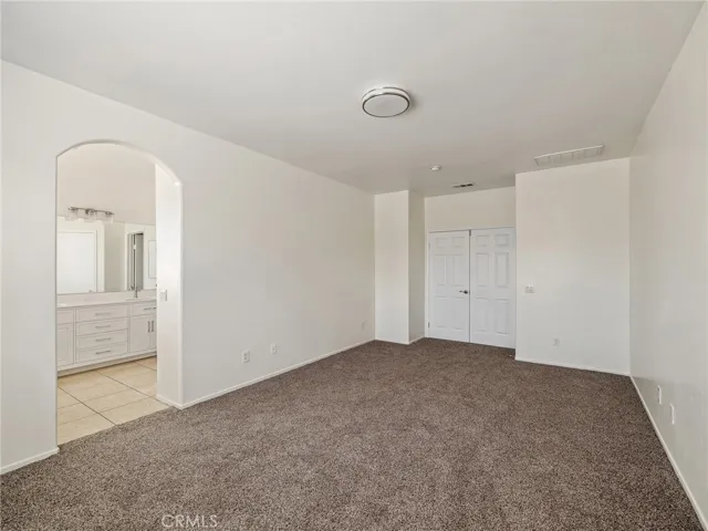 Look at the size of the main bedroom which features double doors, new carpeting and freshly painted. Your private bath is new with tile flooring.