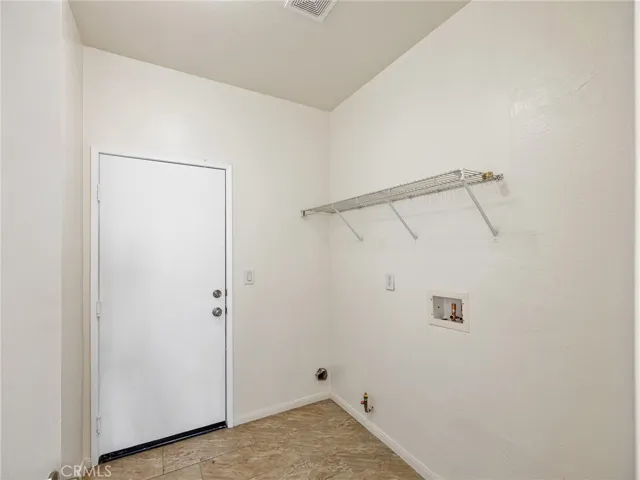 Convenient indoor laundry area adds everyday comfort and functionality - no trips to the garage or outside needed. A convenient interior door provides direct access to the garage for added ease and security.