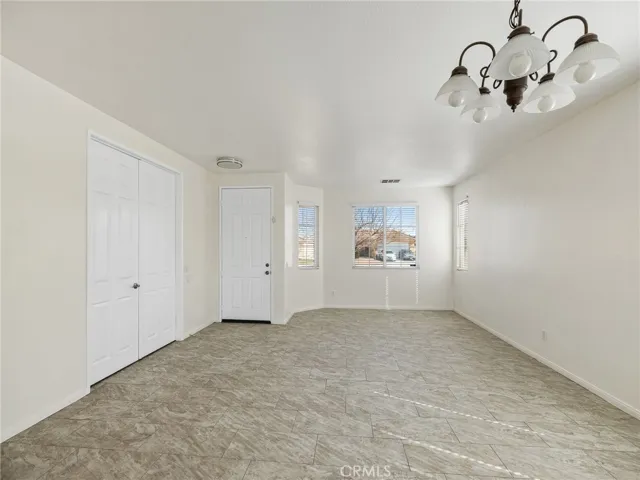 The Den has double doors or if a 4th bedroom is needed a closet could easily be installed. This picture shows your front entrance.