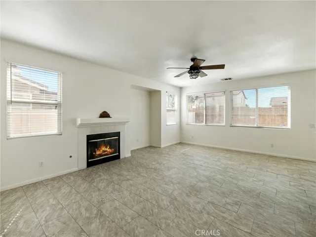 The family room offers comfortable and inviting space perfect for movie nights, gatherings, or simply unwinding at the end of the day! You will enjoy your fireplace on those chilly desert evenings!