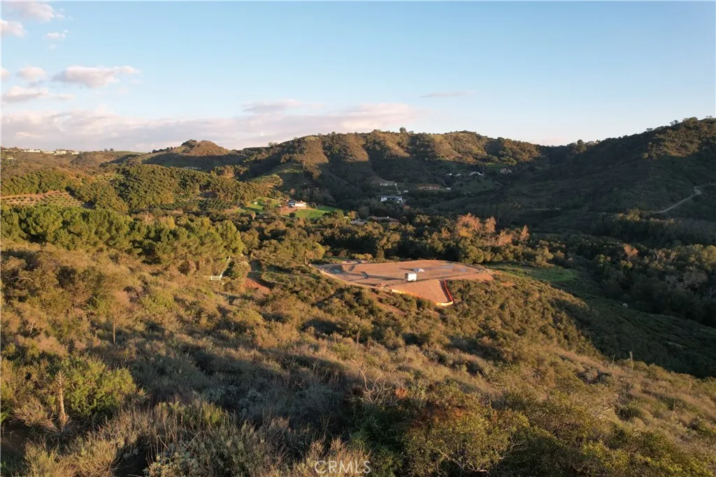 View of neighbors pad from lots highest point looking south east.