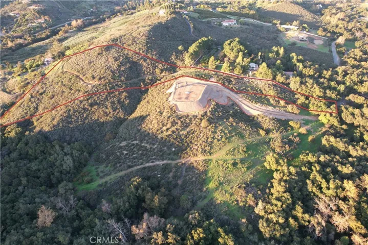 Aerial view of lot with red borderline, buyers to do due diligence of exact lot boundaries.