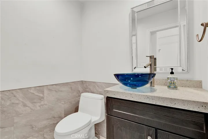 Downstairs remodeled bathroom next to downstairs bedroom