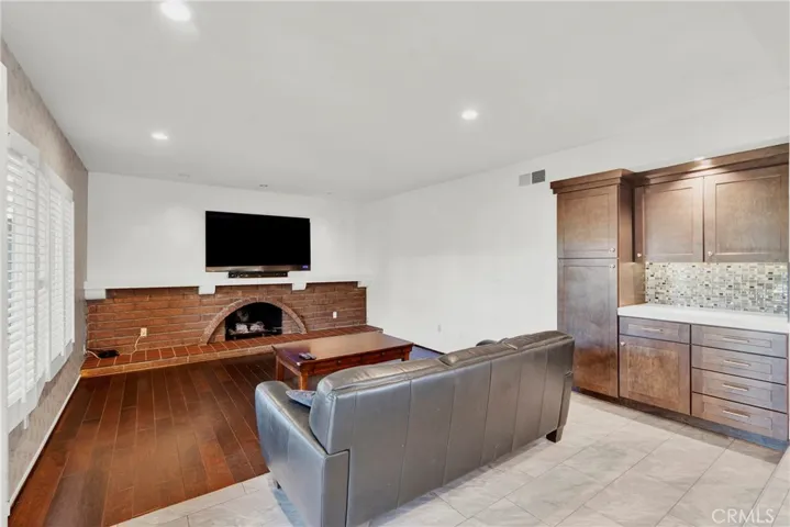 Family room off kitchen with built-in cabinetry
