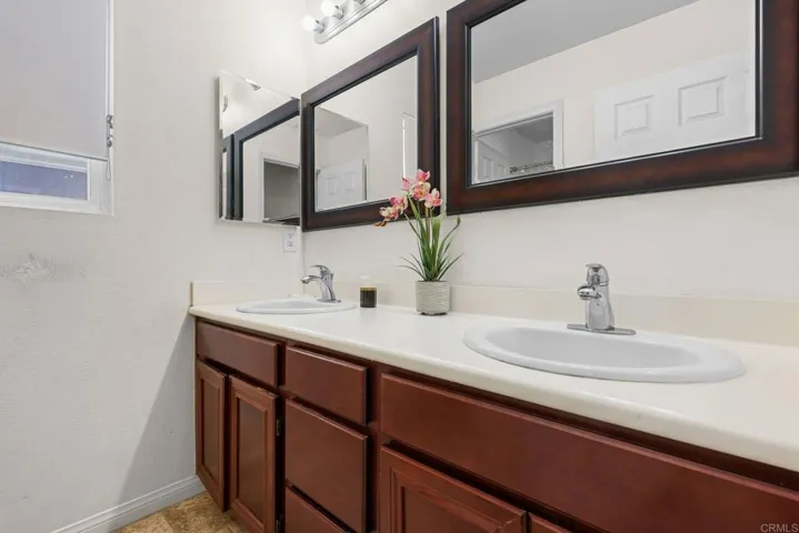 full bathroom with double sinks