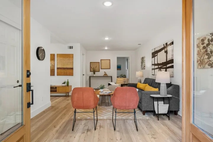 Living area featuring hardwood / wood-style flooring and recessed lighting