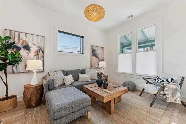 Living room with light wood finished floors and baseboards