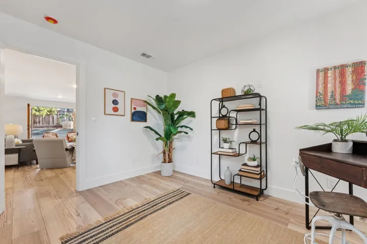 Office area with light wood-type flooring and baseboards
