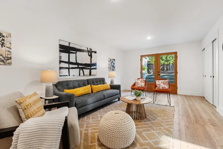 Living area featuring hardwood / wood-style floors, french doors, and recessed lighting