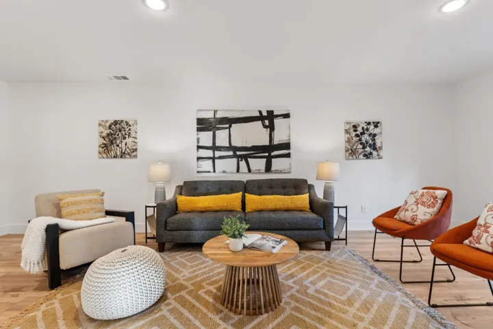 Living area featuring wood finished floors and recessed lighting