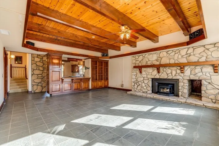 Looking toward the bar and into the kitchen from this spectacular family room