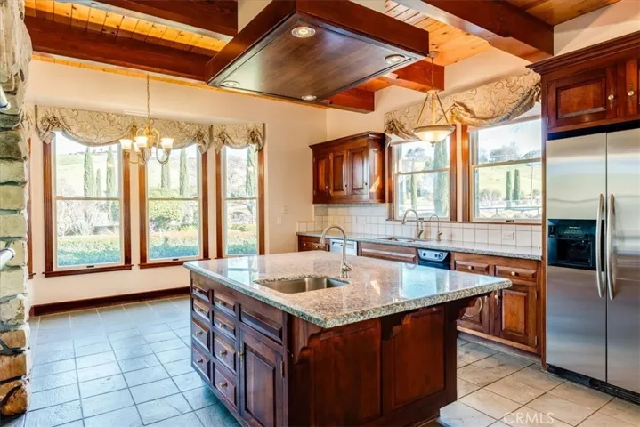 Granite topped kitchen with mahogany cabinetry and Virginia slate flooring